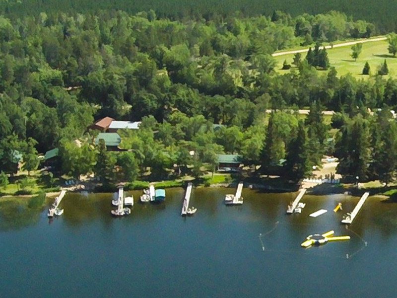 Aerial view of lakeside docks and forest
